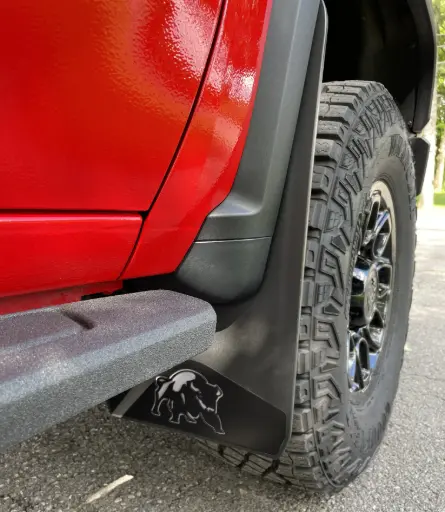 [009405] PKG Chevy 2500 ZR2 Bison Front drill‑lessmud flaps with semi-gloss black powder coated Bison weights & color behind, 2024 – Current 